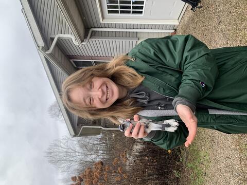 Biz Savitski holding a Blue Jay