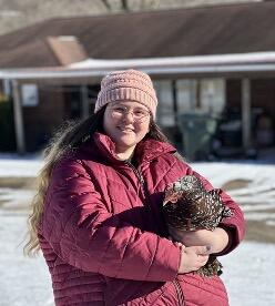 Molly Murphy holding a chicken