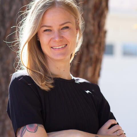 Dr. Cassie Boness wearing a black top with arms crossed.