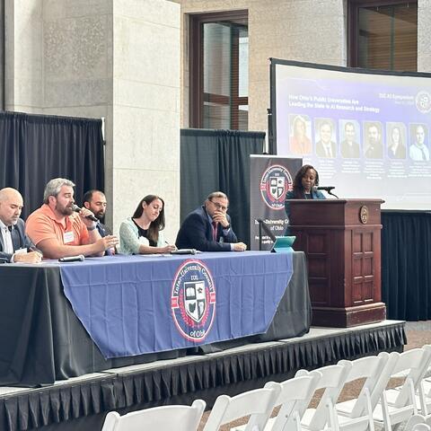 A panel containing Prof. Mourning and others.