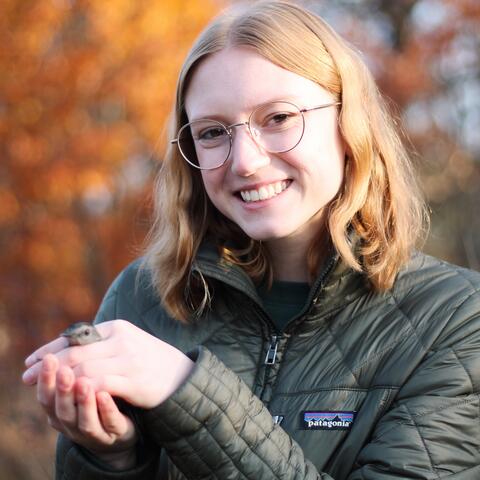 Emma holding a Gray Catbird