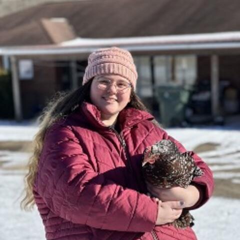 Molly Murphy holding a chicken