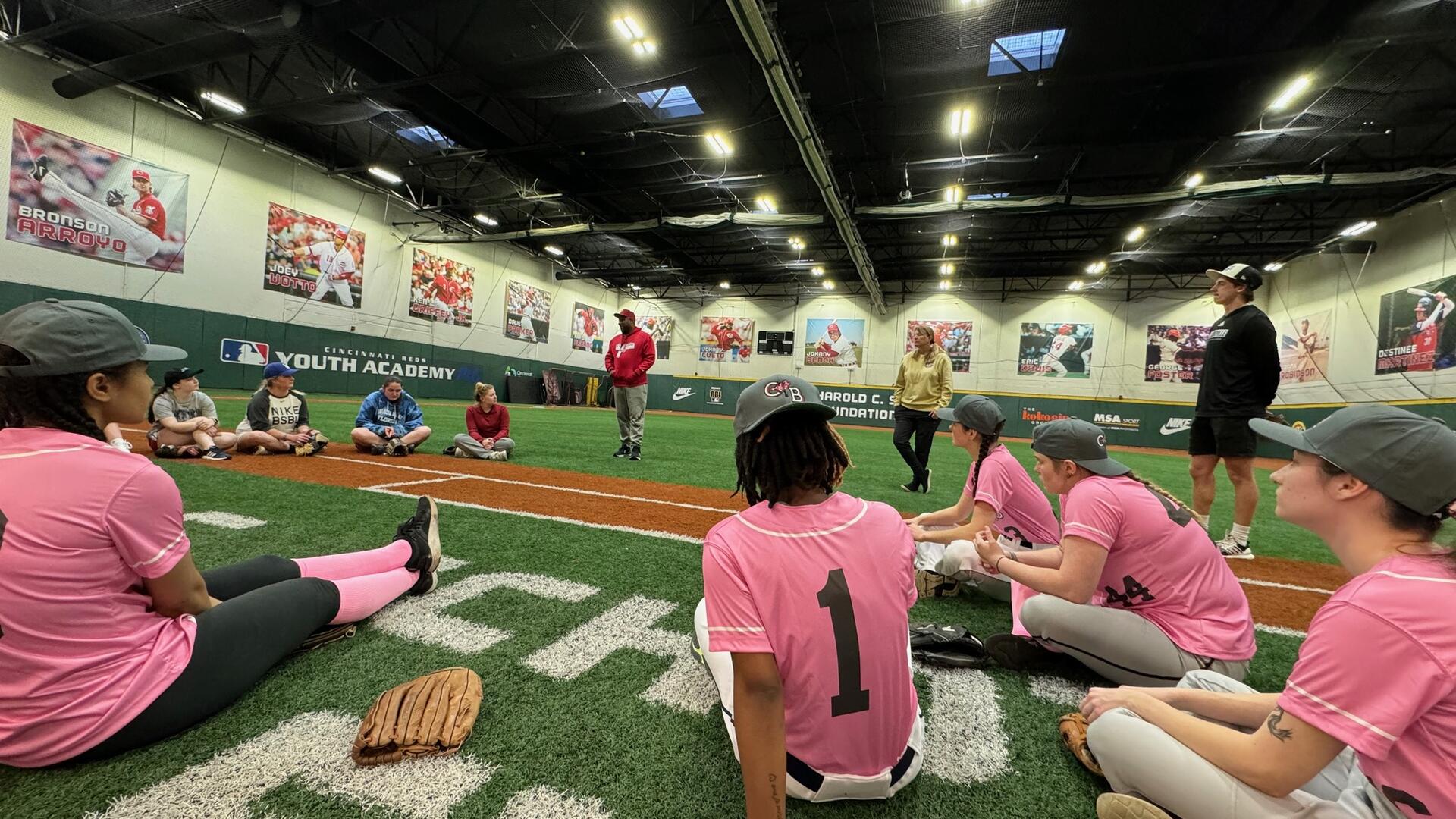 Cherry Bombs players sitting on the turf